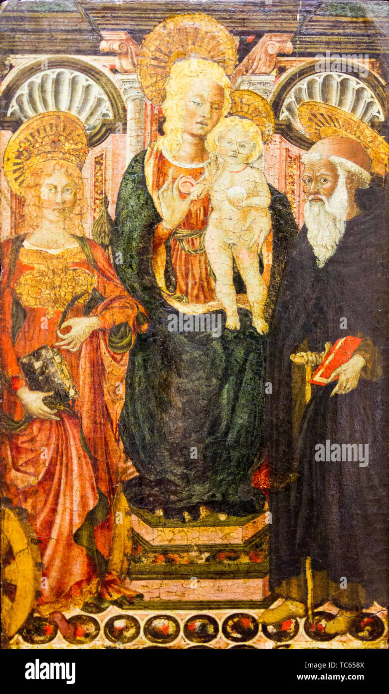 Die Jungfrau Maria mit dem Jesuskind auf einem Thron zwischen St. Katharina von Alexandrien und St. Antonius (der Große). Stockfoto