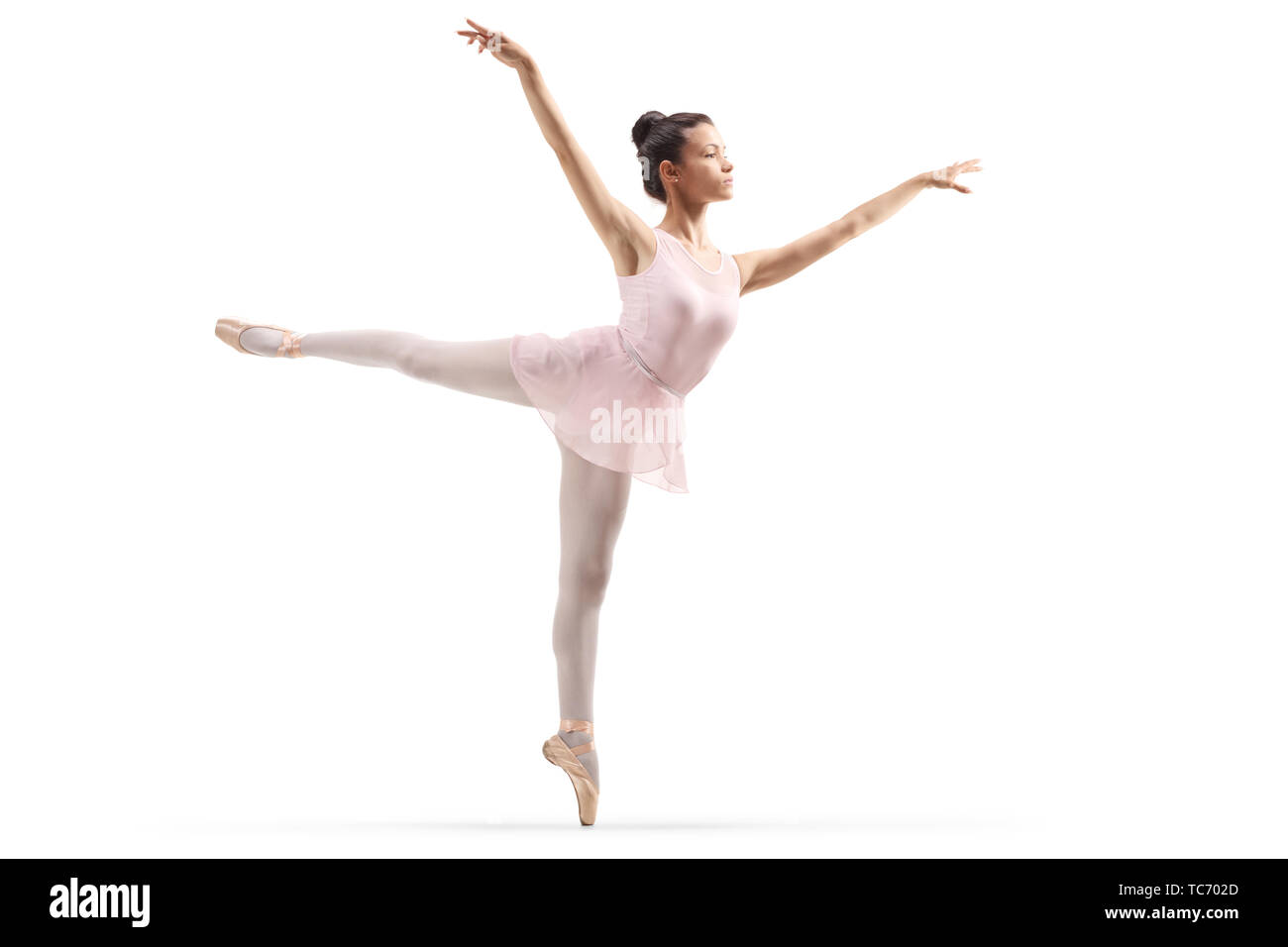 Volle Länge Schuß einer jungen schönen Ballerina tanzen auf weißem Hintergrund Stockfoto