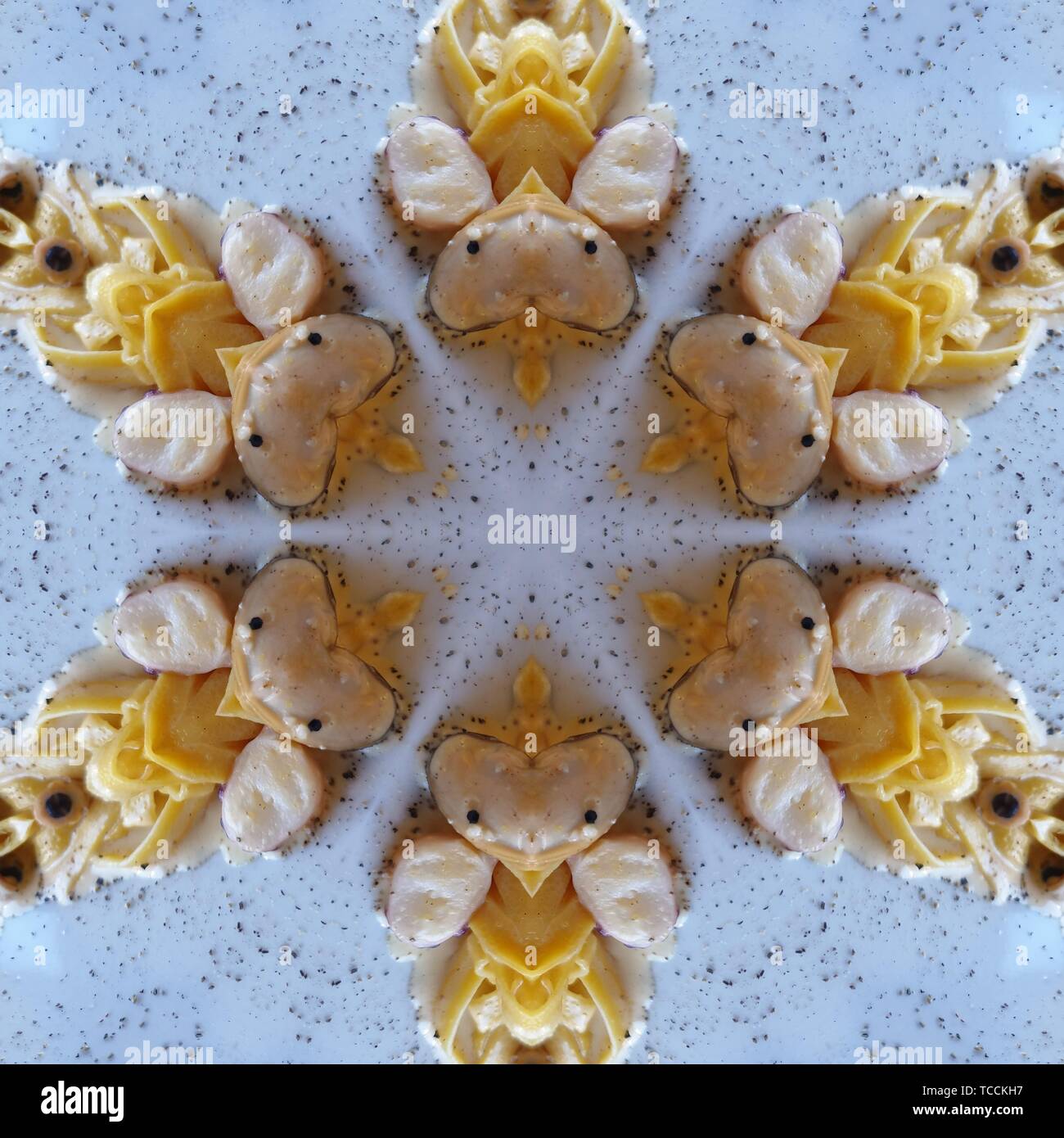 Grafik mit Kaleidoskop Design abstrakt mit yellowtones Stockfoto