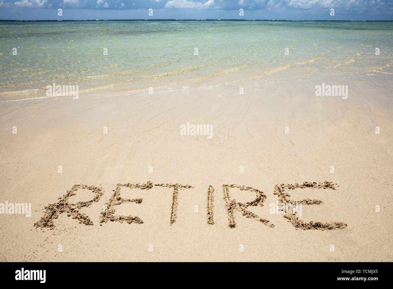 Einen Überblick über den Ruhestand Text am Sandstrand Stockfoto