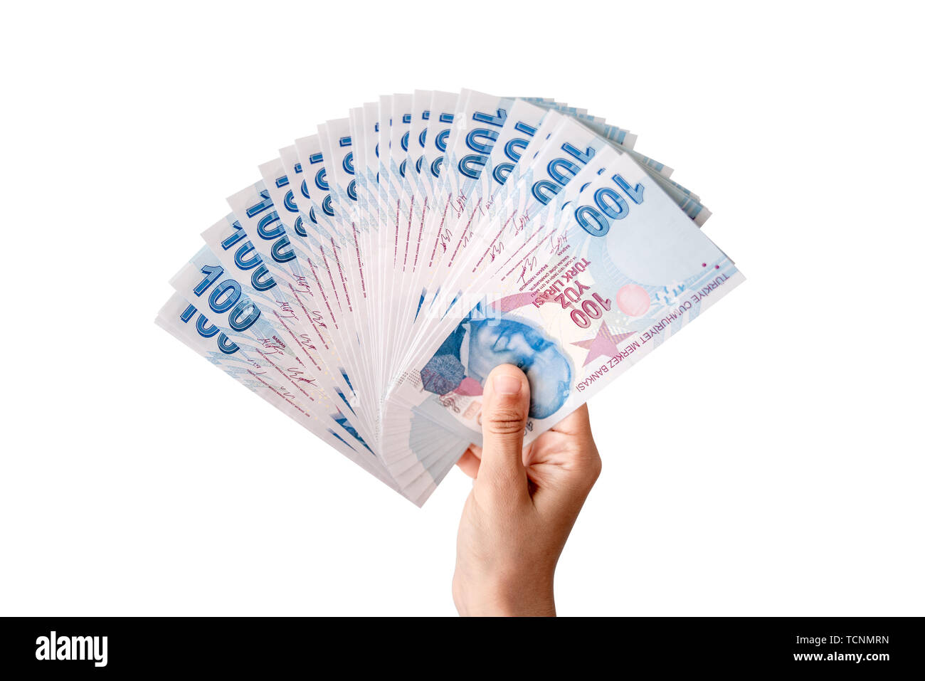 Die menschliche Hand, die Türkische Geld. Auf weissem Hintergrund Stockfoto