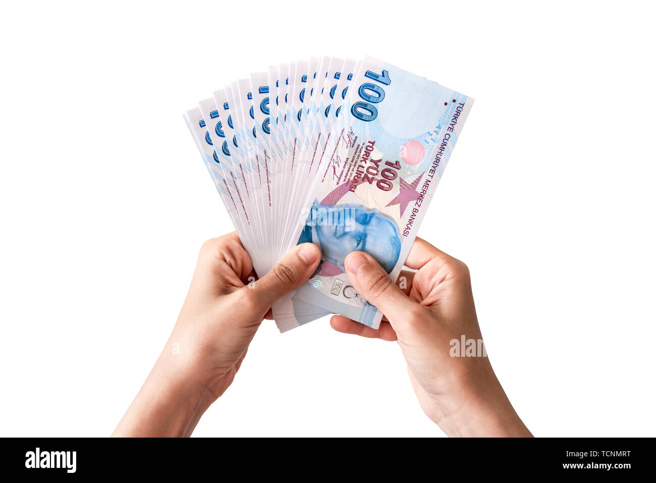 Die menschliche Hand, die Türkische Geld. Auf weissem Hintergrund Stockfoto