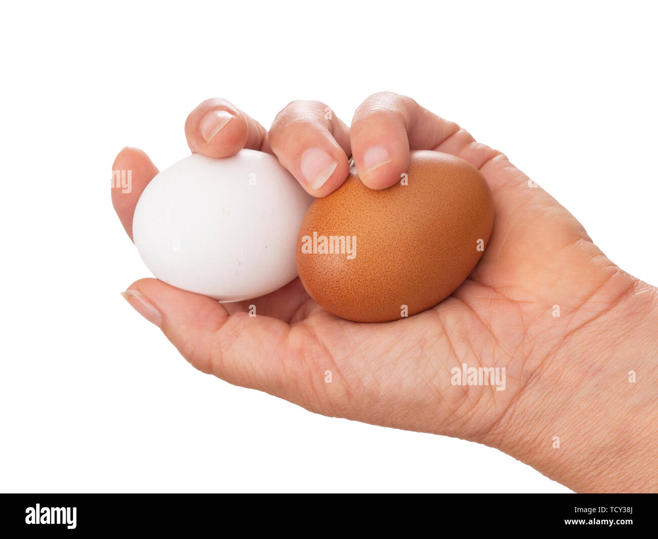 Hand mit zwei Eier. Braune und weiße Farbe. Auf weiß isoliert. Stockfoto