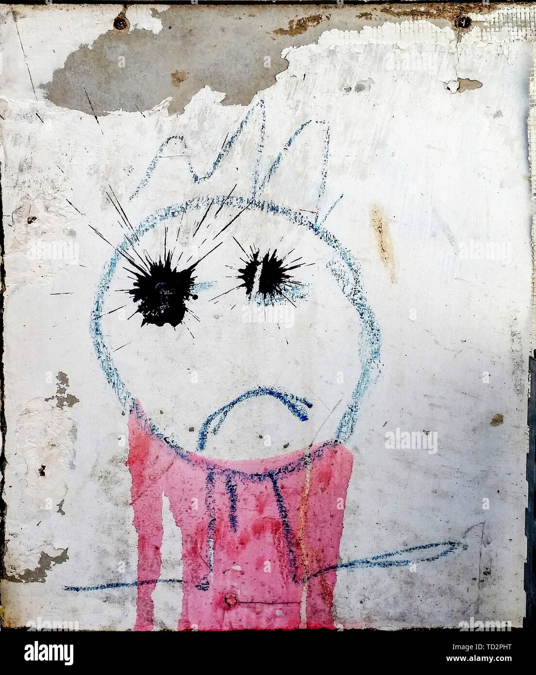Emoji eines traurigen junge Naive Malerei Graffiti an der Wand Stockfoto
