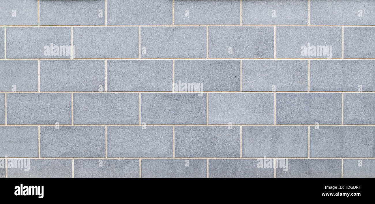 Hochauflösende full frame Hintergrund für eine neue, moderne und saubere Wände oder Gebäude Exterieur aus Licht bläulich grauen Steinplatten. Stockfoto