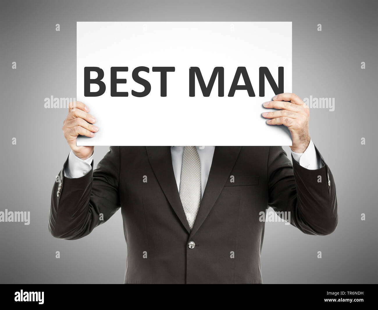 Geschäftsmann mit einem Schild mit der Aufschrift beste Mann, Deutschland Stockfoto