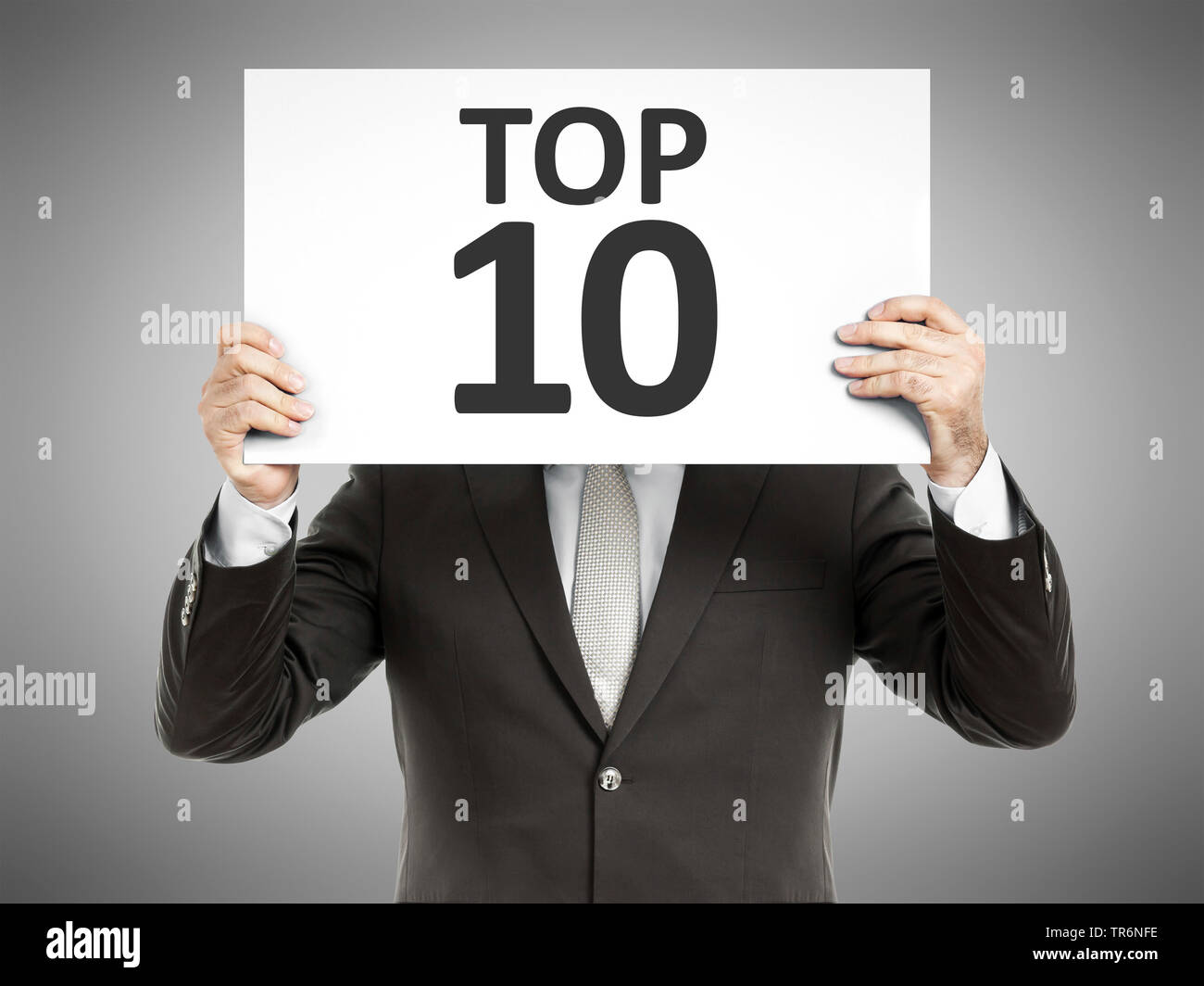 Geschäftsmann mit einem Schild mit der Aufschrift Top 10, Deutschland Stockfoto