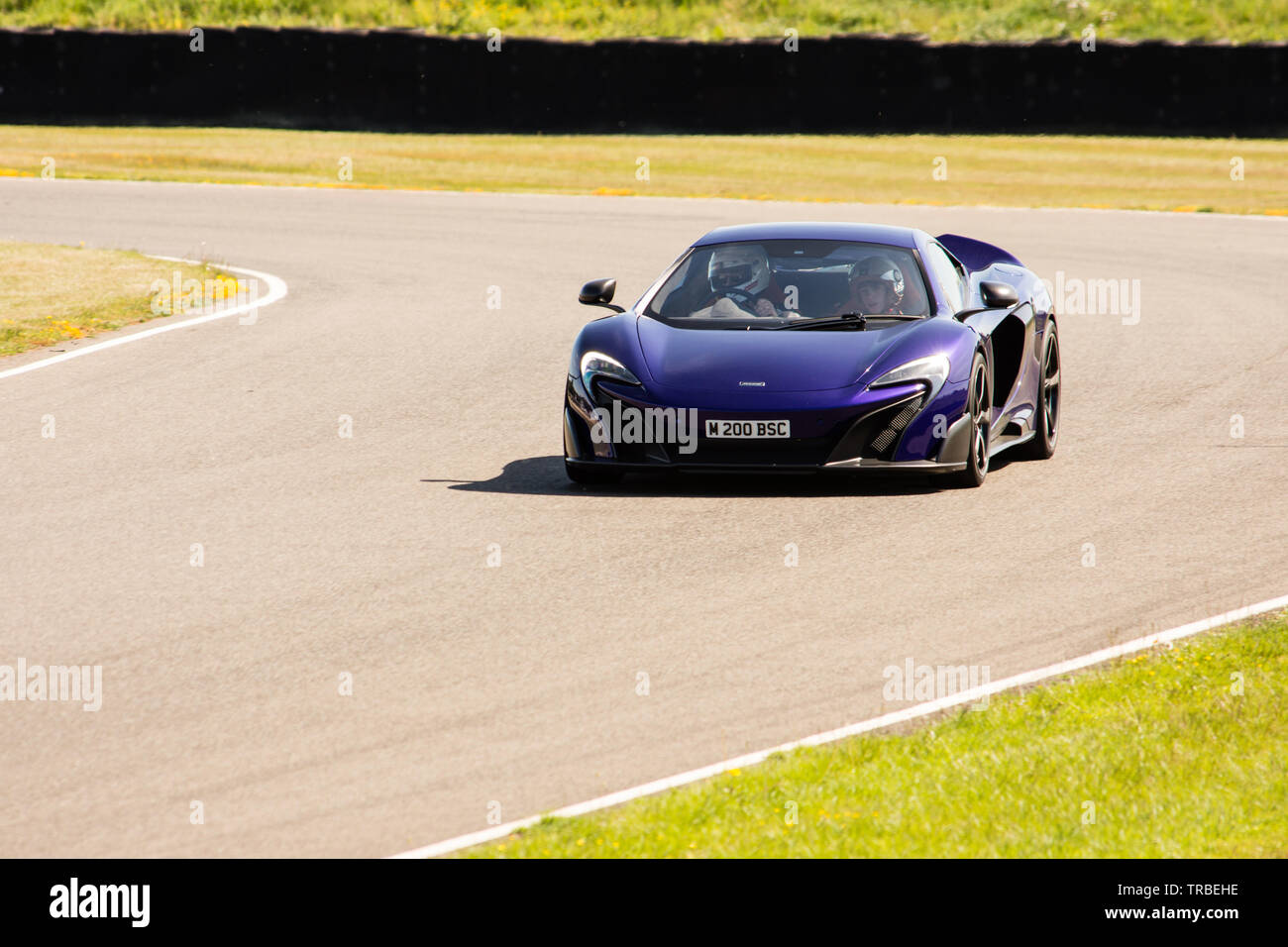 McLaren 675 lt Super Auto, Passagiere runde Goodwood für Nächstenliebe Stockfoto