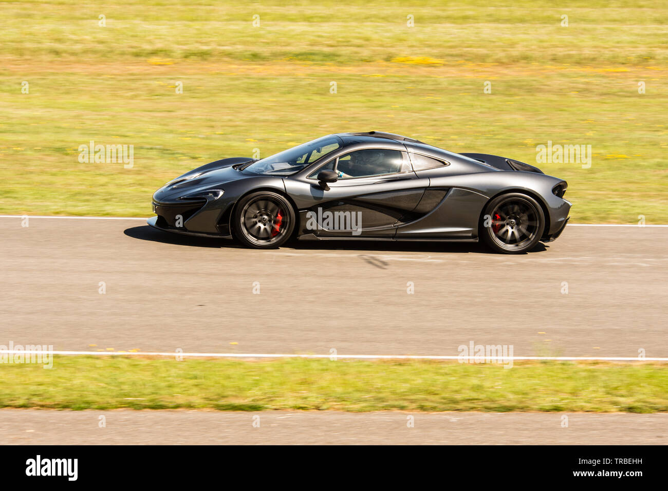 McLaren 675 lt Super Auto, Passagiere runde Goodwood für Nächstenliebe Stockfoto