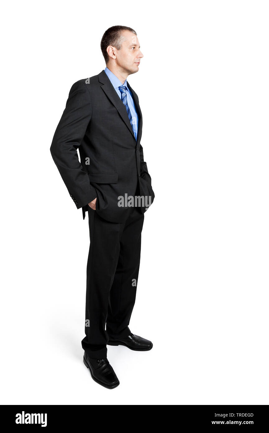 Seite Portrait von einem Geschäftsmann in einem grauen Anzug mit Händen in  den Hosentaschen Stockfotografie - Alamy