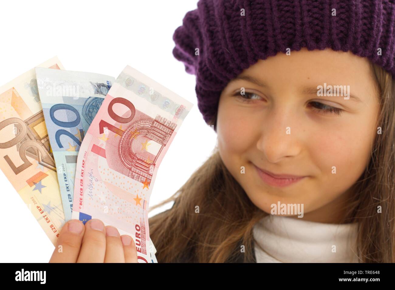 Portrait einer jungen sympathischen Mädchen holding Euro Geldschein in der Hand. Stockfoto