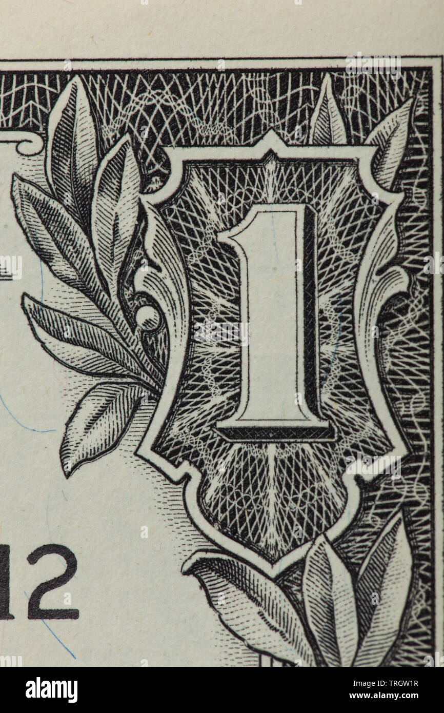 Vor einer 1 Dollar Bill mit Schwerpunkt auf der 1 in der Ecke Stockfoto