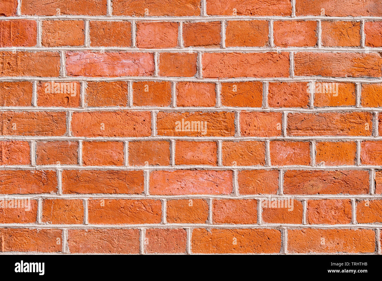 Rote raue Mauer hautnah. Textur und Hintergrund Stockfoto