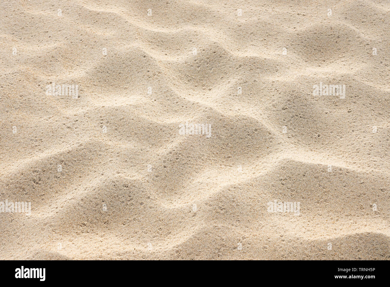 Strand Sand Textur. Sommer Hintergrund mit einem Fragment des Badeortes entfernt. Abstraktion in der Natur Stockfoto