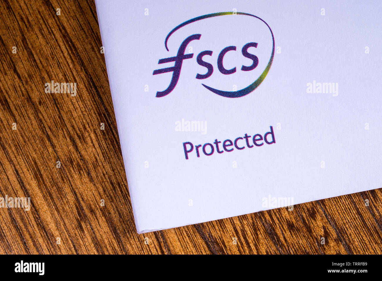 London, UK, 11. Juni 2019: eine Nahaufnahme des FSCS - Financial Services Compensation Scheme logo, abgebildet auf eine Informationsbroschüre. Stockfoto