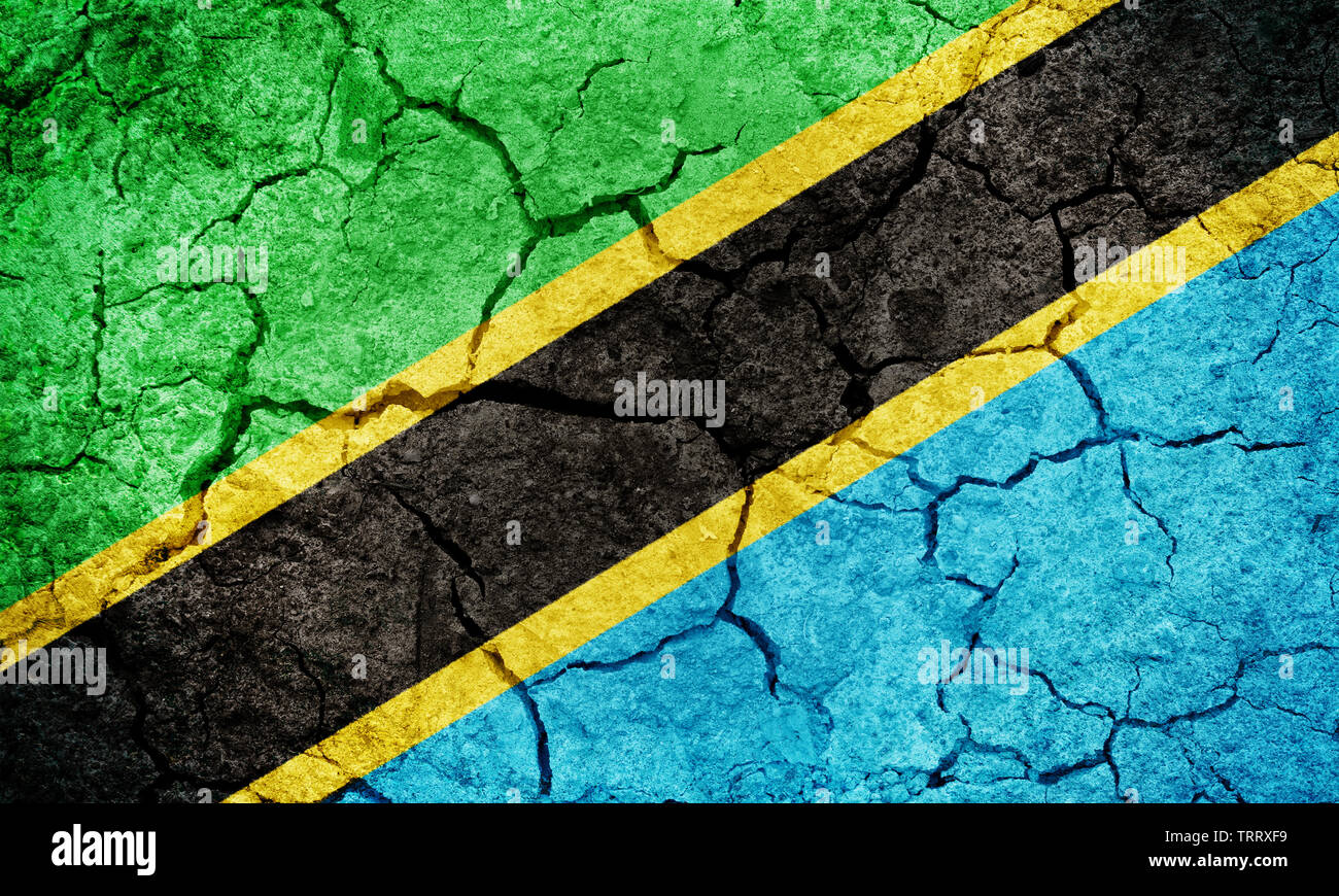Vereinigte Republik Tansania Flagge auf trockener Erde Boden Textur Hintergrund Stockfoto