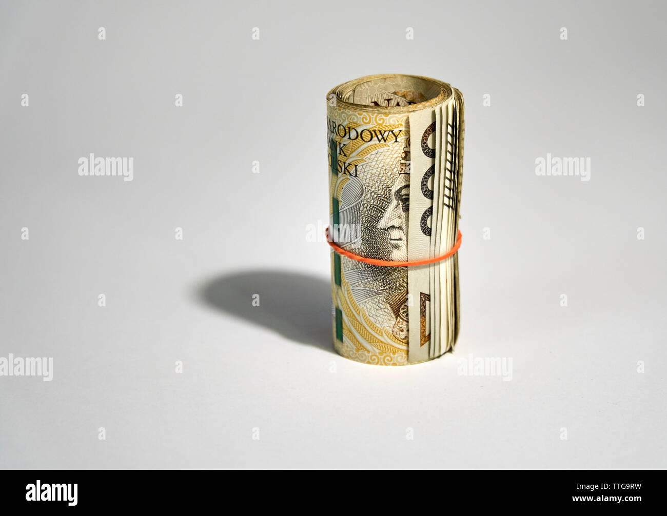 Aufgerollt polnischen Geld (PLN) - 200 Polnische Zloty Rechnungen auf weißem Hintergrund Stockfoto