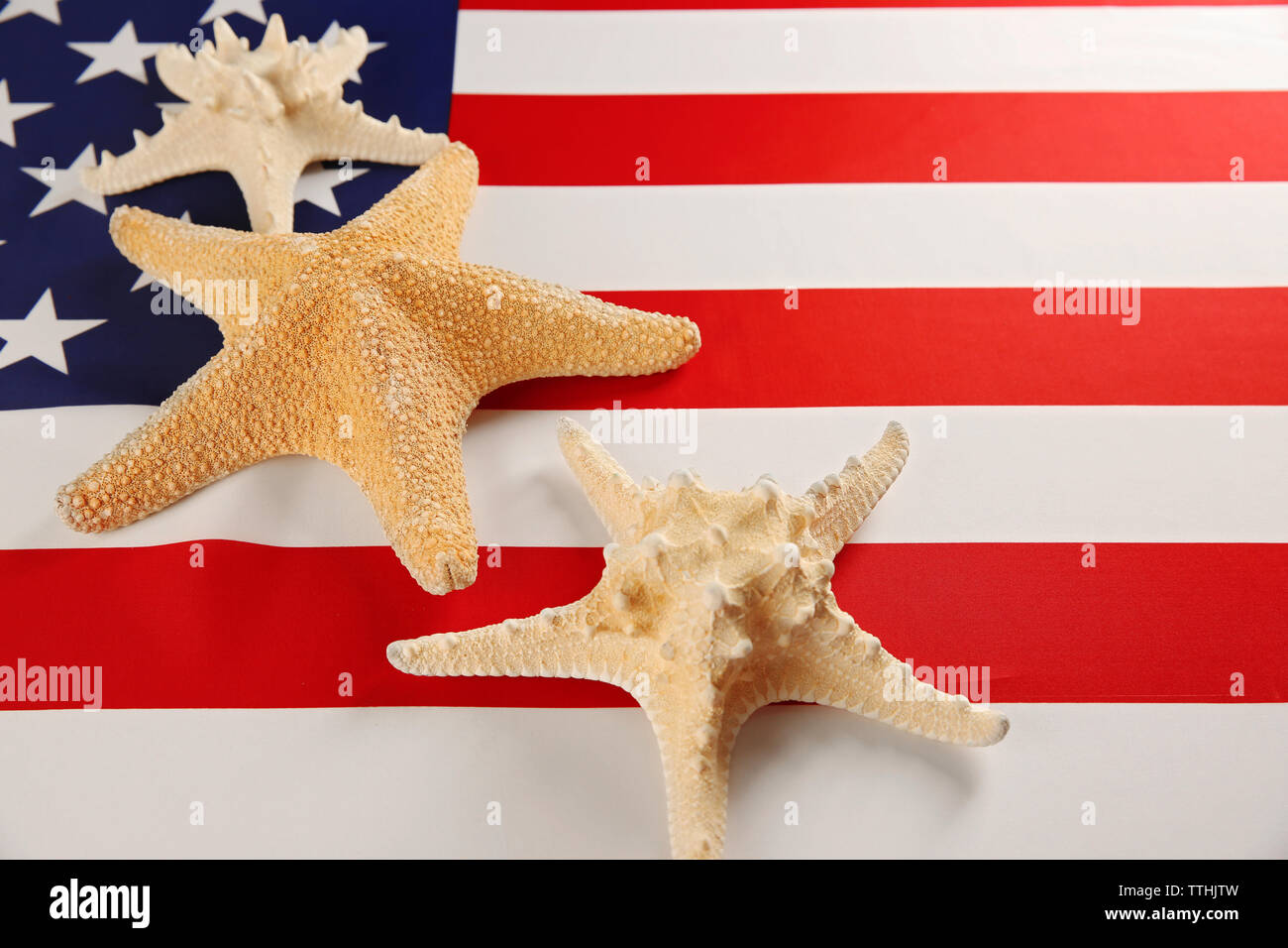 Tag der Arbeit Konzept. Auf USA Nationalflagge Hintergrund Starfish Stockfoto