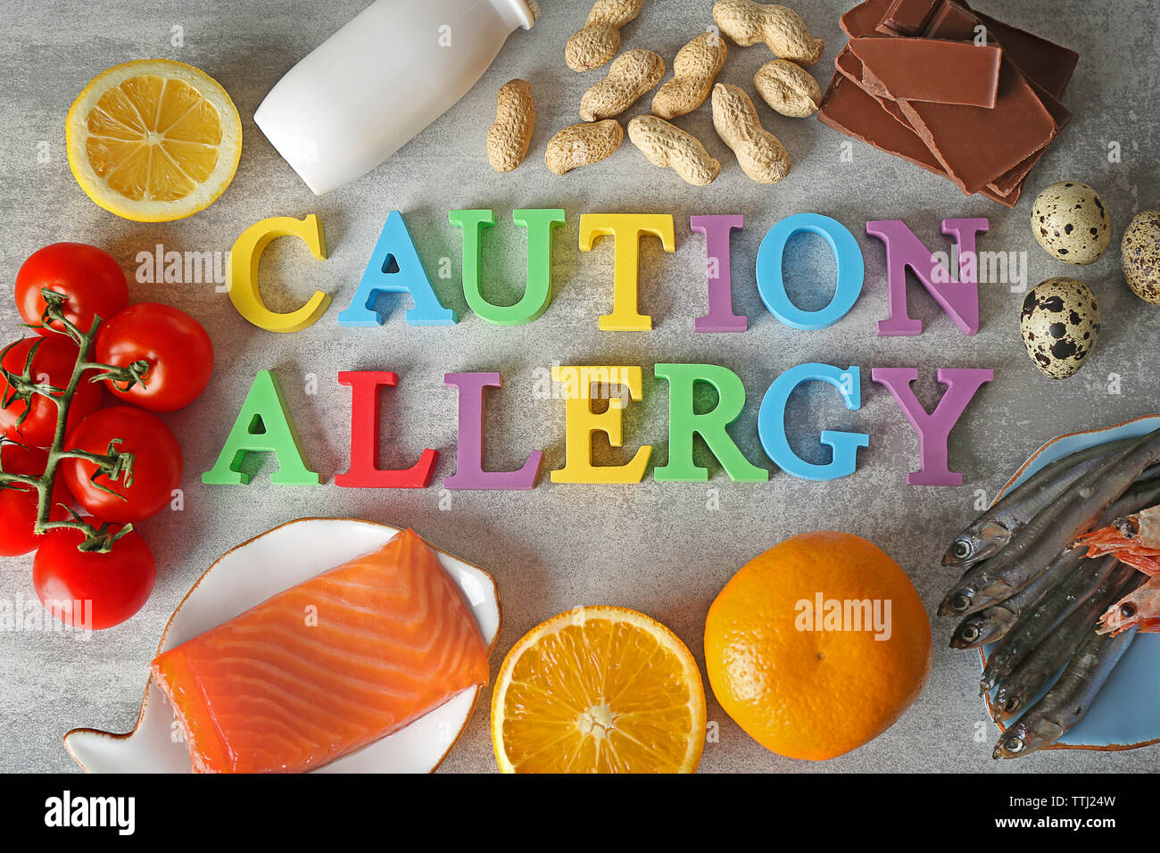Satz von allergische Lebensmittel auf Grau strukturierten Hintergrund Stockfoto