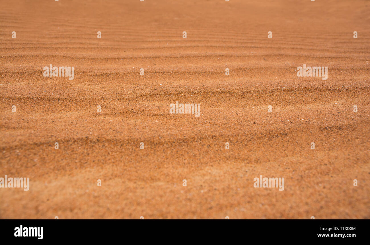 Nahaufnahme der Wüste Sand Dünen schöne orange Farbton Sand Textur Hintergrund Stockfoto
