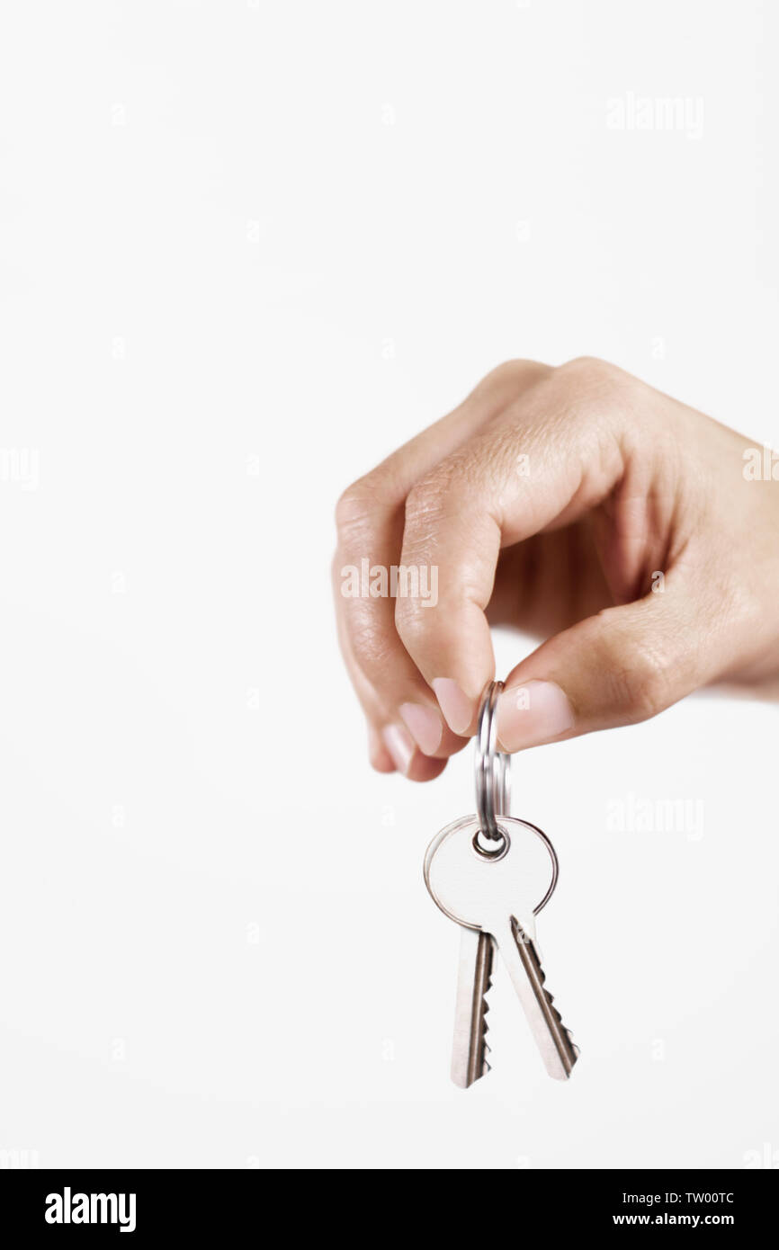 Nahaufnahme einer Person, die die Tasten hält Stockfoto