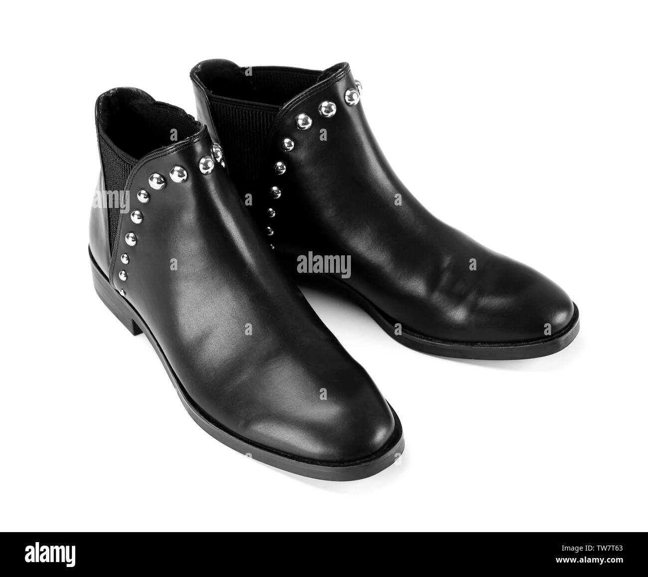 Paar schwarze weibliche Stiefel auf weißem Hintergrund Stockfoto