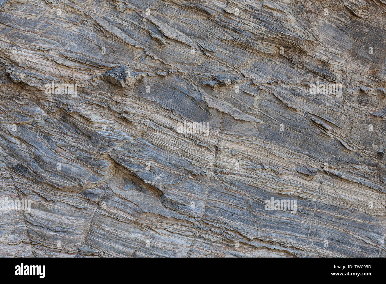 Naturstein Textur. Natürliche Beschaffenheit des Felsens Oberfläche, wo Sie die Zeilen in der langen Zeit gezeichnet sehen können. Kann als Hintergrund verwendet werden. Stockfoto