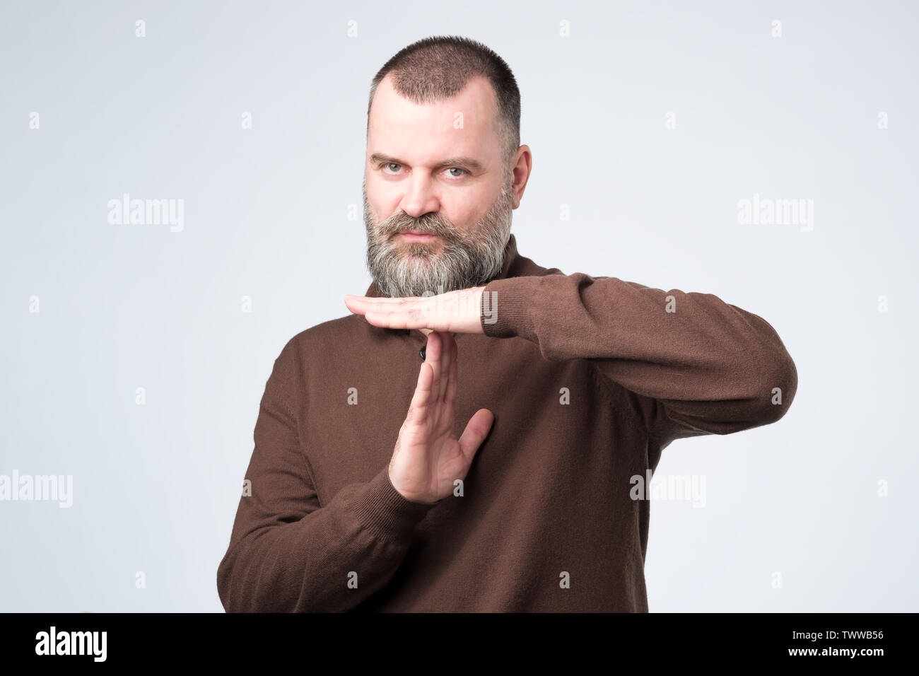 Mann, Zeit, Geste. Ich brauche eine Pause zu machen. Stockfoto