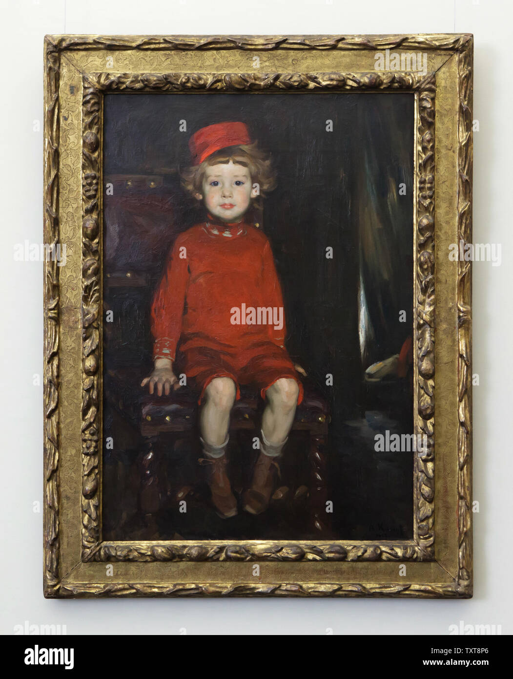 Gemälde "Junge in Rot" von Deutschen impressionistischen Malers Arthur Kampf (1907) auf dem Display in der Alten Nationalgalerie (Alte Nationalgalerie) in Berlin, Deutschland. Stockfoto