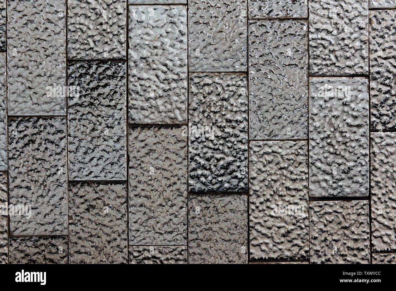 Zusammenfassung Hintergrund von texturierten Schwarz und Weiß glänzende Keramikfliesen. Stockfoto