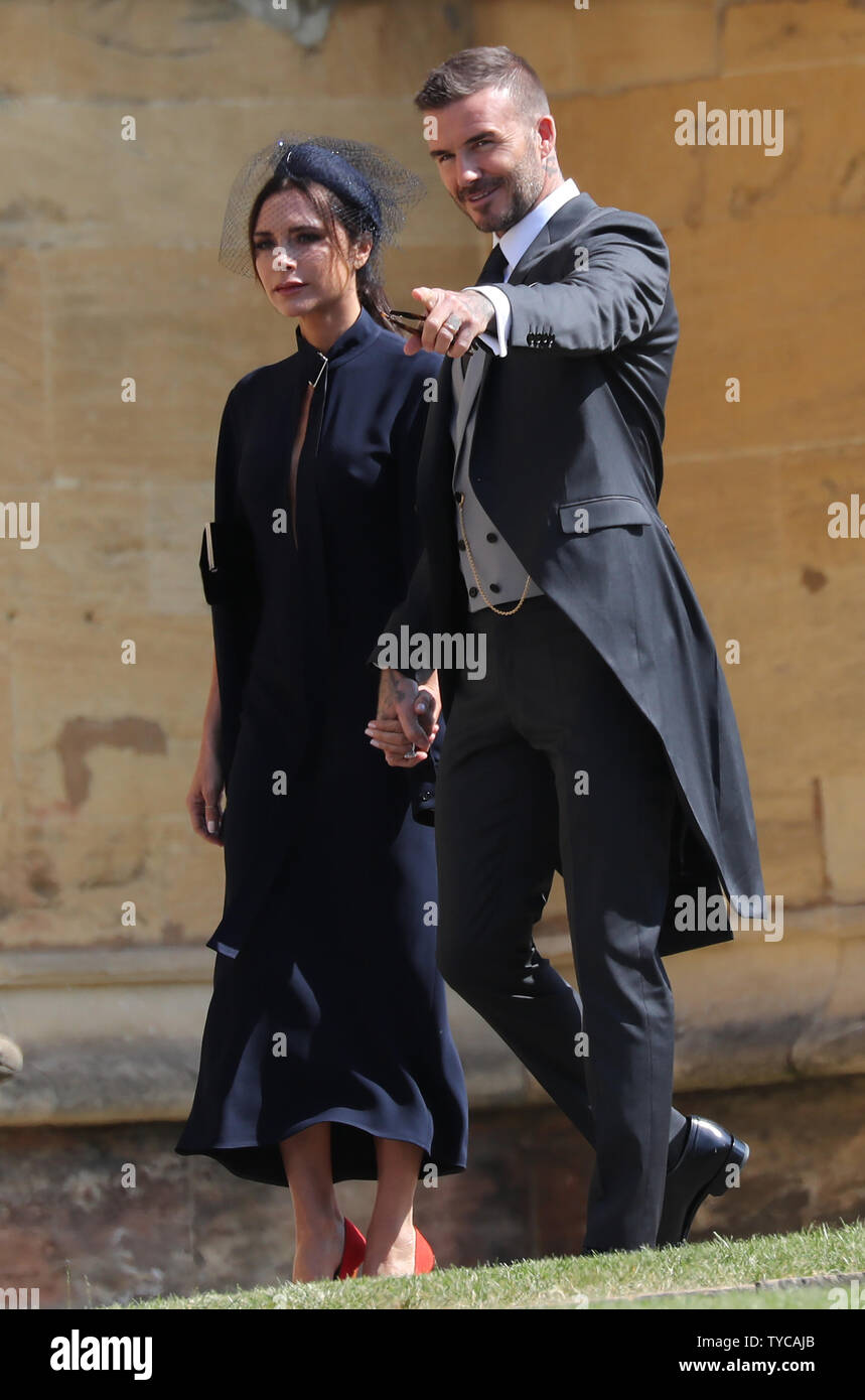 Britische celebrity David Beckham und seine Frau Victoria kommen für die Hochzeit von Prinz Harry und Meghan Markle im St George's Chapel in Windsor, London, 19. Mai 2018. Foto von Hugo Philpott/UPI Stockfoto