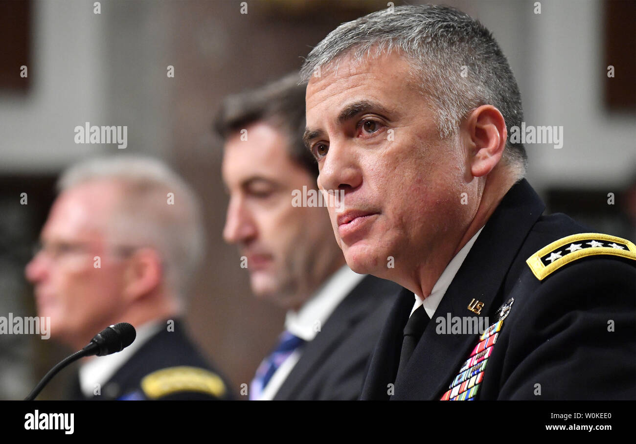 Gen. Paul Nakasone, Kommandant der US-Cyber Command, Director, National Security Agency und Chief, Zentrale Security Service zeugt neben Owen West (C), Stellvertretender Sekretär für Verteidigung, spezielle Operationen und Low-Intensity Conflict und Gen. Raymond A. Thomas, III, Commander, United States Special Operations Command, während einer Anhörung im Senat Armed Services Committee on U.S. Special Operations Command und der US-Cyber Command einschließlich der Bedrohungen, die die Vereinigten Staaten und die Defense Authorization Act, auf dem Capitol Hill in Washington, D.C. am 14. Februar 2019. Foto von Kevin Dietsch/U Stockfoto