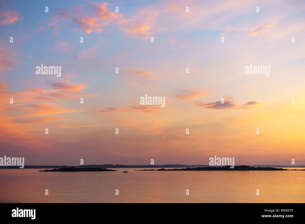 Sonnenuntergang über dem Murray Inseln von Carrick, Dumfries and Galloway, Schottland Stockfoto