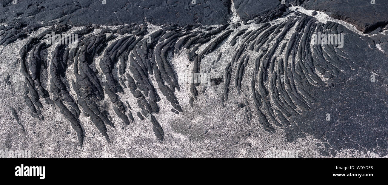 Erstarrter Lava mit hellen Sand in Nahaufnahme Stockfoto
