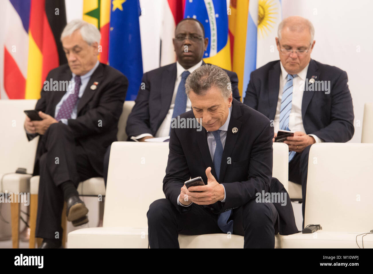 Von links, chilenische Präsident Sebastian?? n Pi?? ära Präsident von Senegal Macky Sall, argentinische Präsident Mauricio Macri und der australische Premierminister Scott Morrison an einem Treffen der G20-Staats- und Regierungschefs auf das Empowerment von Frauen rund um die Welt während des G20-Gipfels in Osaka, Japan. Stockfoto