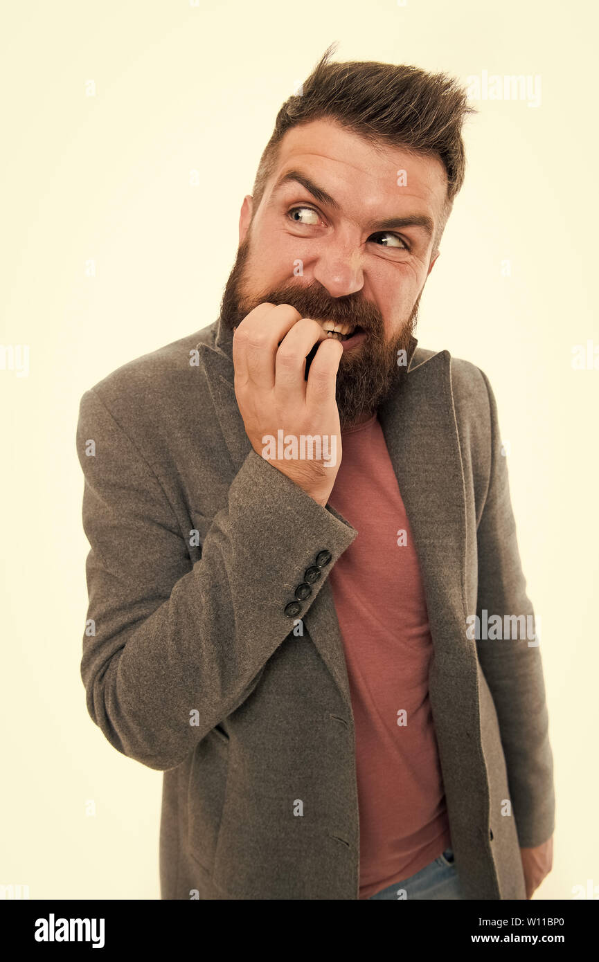 Man bärtige Hipster zweifelnd Gesicht finger beißt beim Denken. Nervös Entscheidung treffen. Hipster brutal nervös nachdenklichen Gesichtsausdruck. Nervös Entscheidung Konzept. Nervös über die Lösung des Problems. Stockfoto