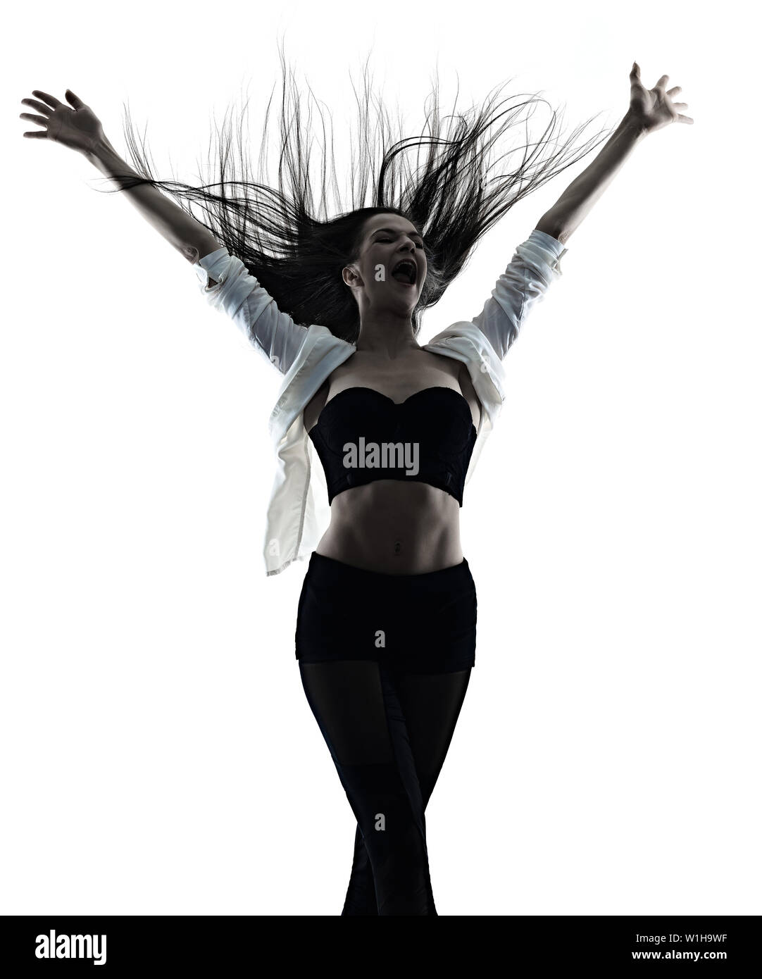 Eine junge schöne lange Haare kaukasische Frau modernes Ballett disco Tänzer Tanz Studio shot silhouette Schatten auf weißem Hintergrund Stockfoto