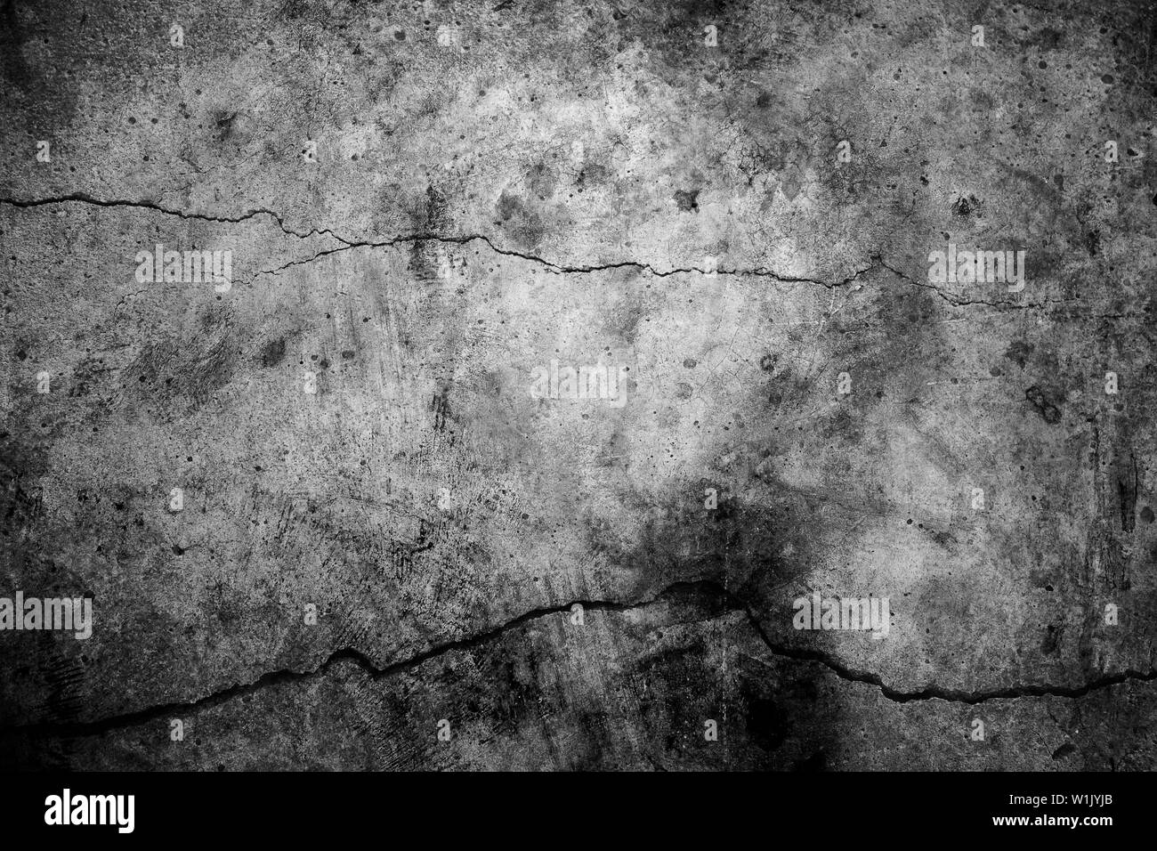 Schwarzen und weißen Zement Risse im Hintergrund Stockfoto