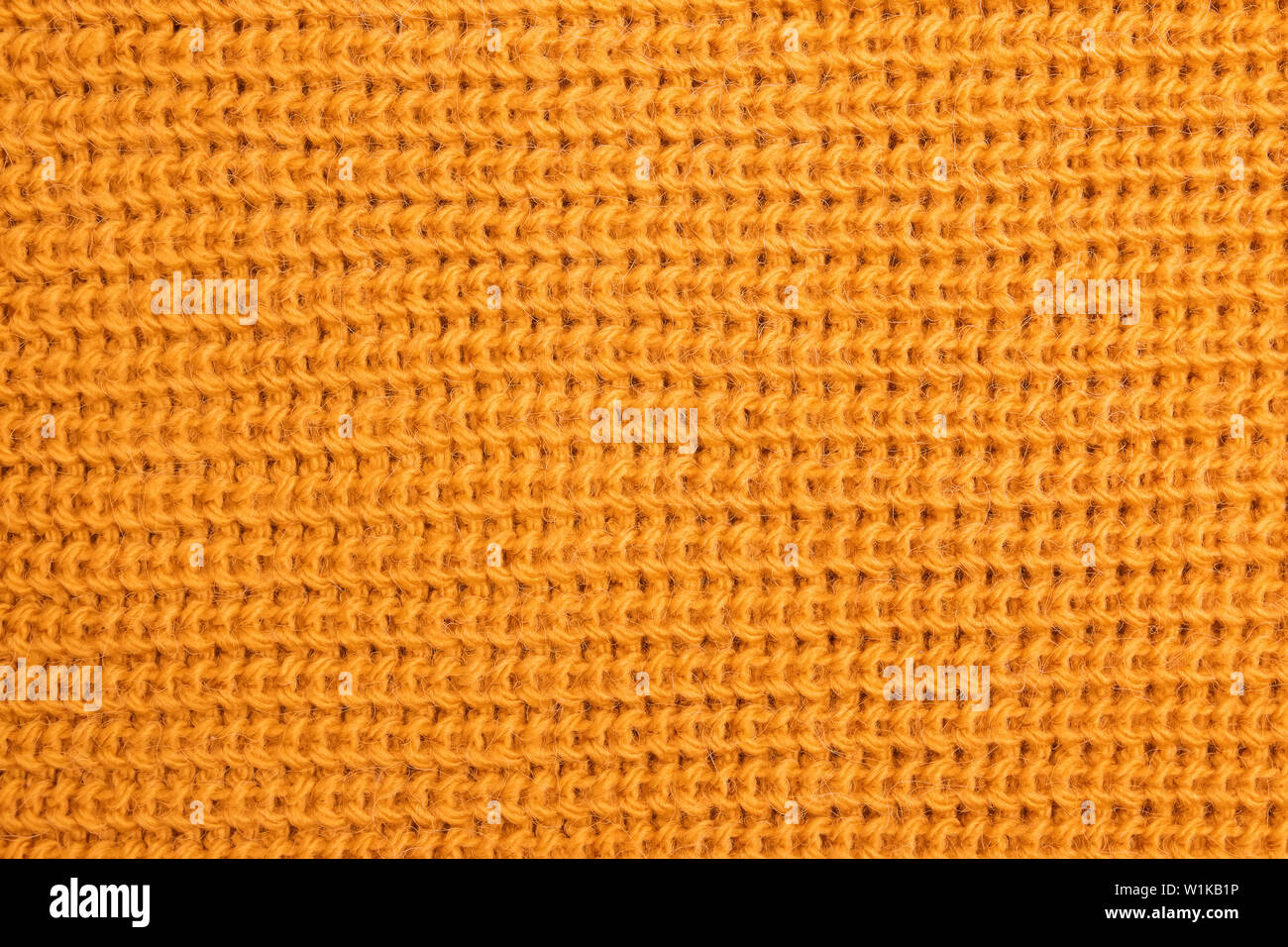 Wolle gestrickt Textur leuchtend gelben oder Senf Farbe close-up Stockfoto