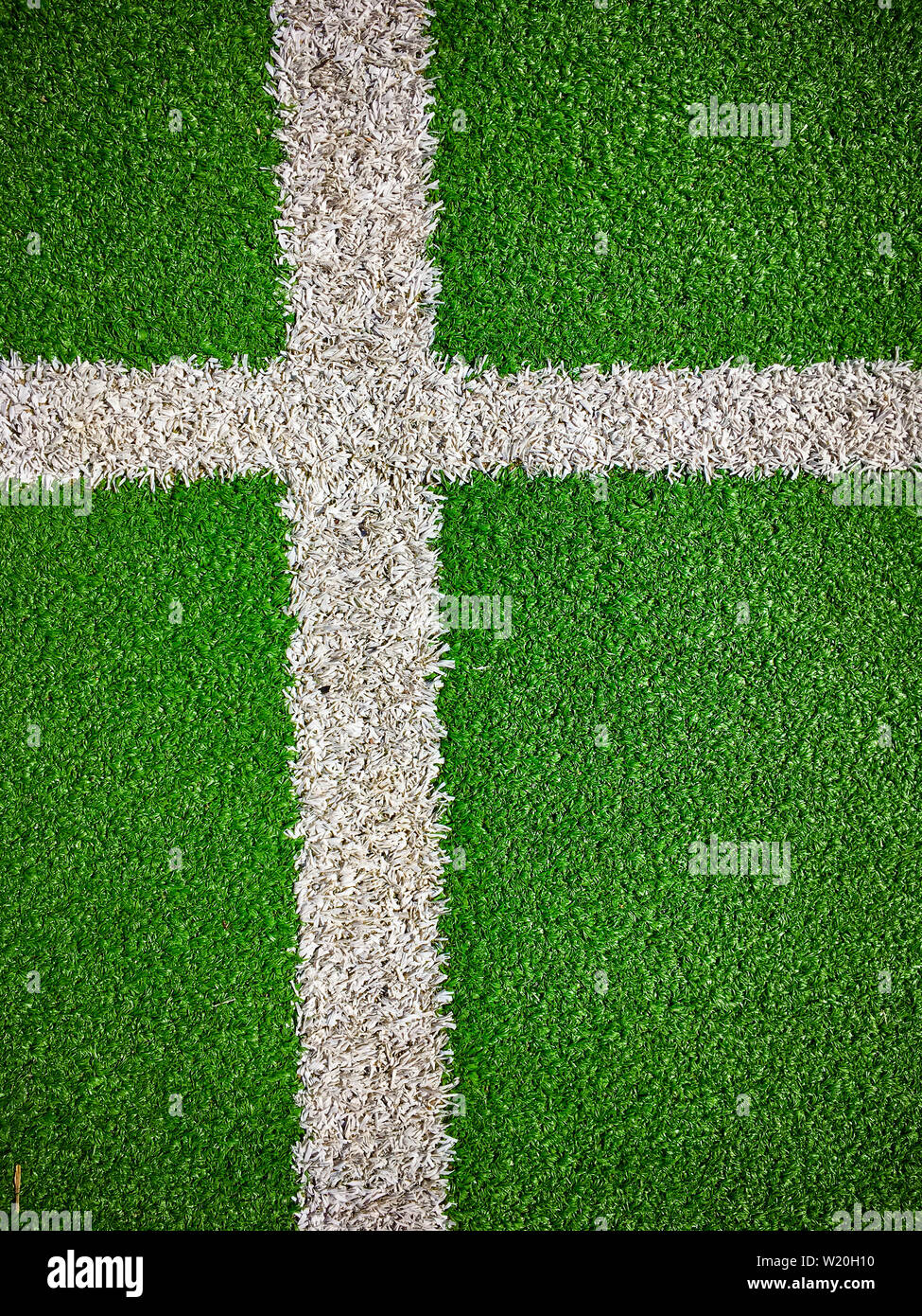 Fußballplatz mit Kunstrasen Rasen closeup Draufsicht Stockfoto