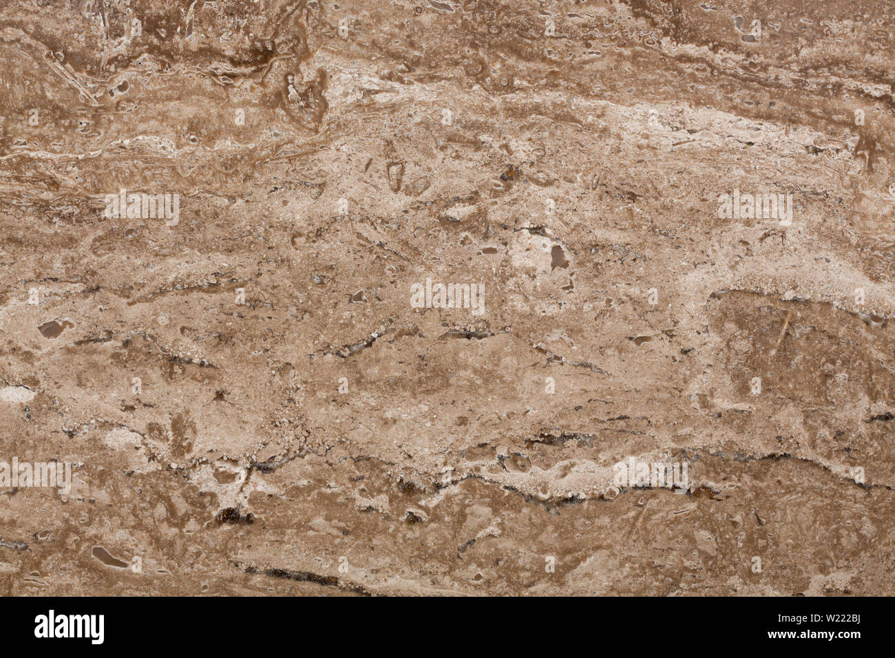 Travertin klassische warme beige Farbe mit einem ausgeprägten Streifenbildung ein Stockfoto