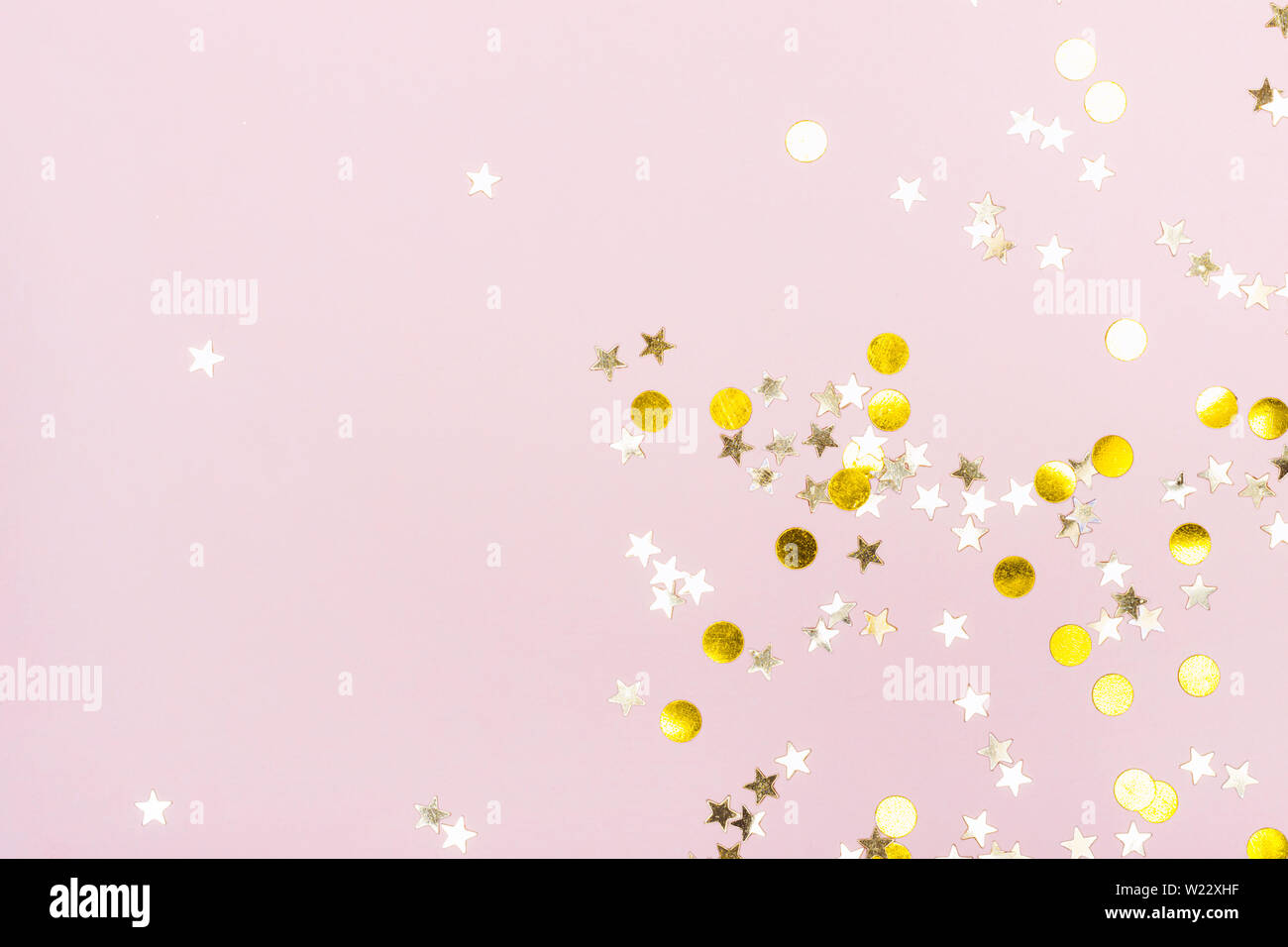 Festliche Hintergrund mit Gold funkelt auf rosa Hintergrund. Stockfoto