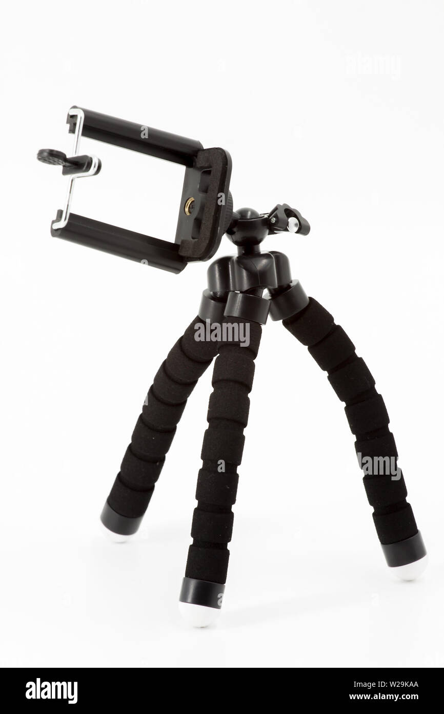 Mini Stativ für Smartphone auf weißem Hintergrund Stockfoto