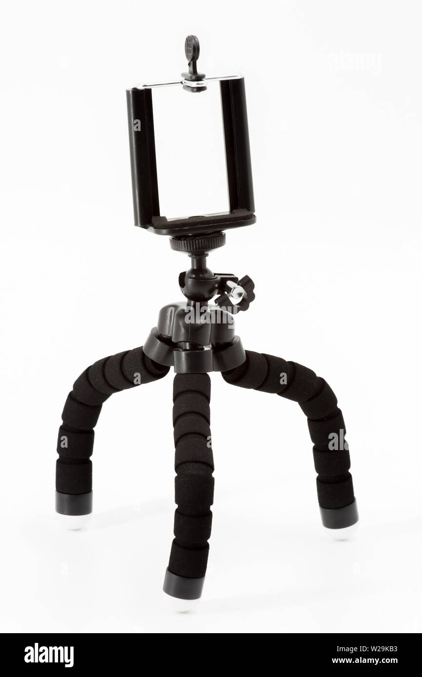 Mini Stativ für Smartphone auf weißem Hintergrund Stockfoto