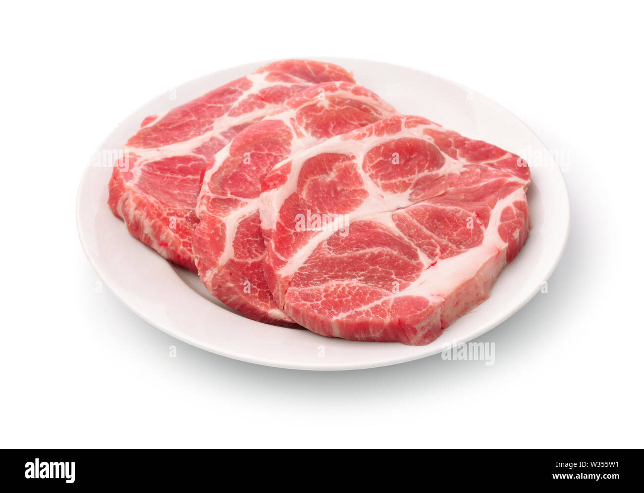 Rohe frische Schweinekamm Fleisch Steaks isoliert auf weißem Stockfoto