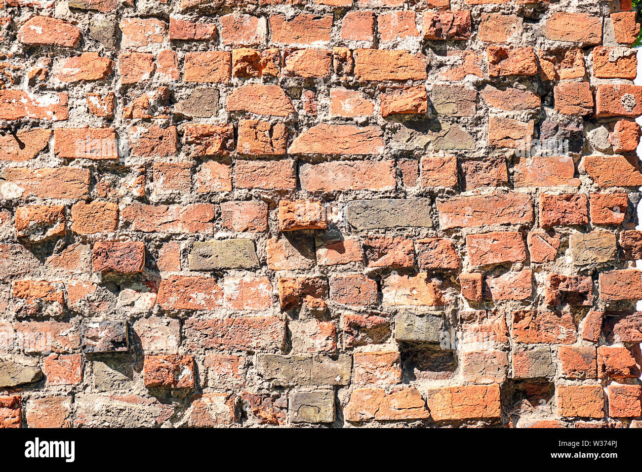 Hintergrund von einem gebrochenen Red brick wall Stockfoto