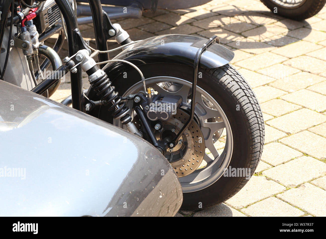 Details über ein Motorrad mit Kinderwagen. Stockfoto