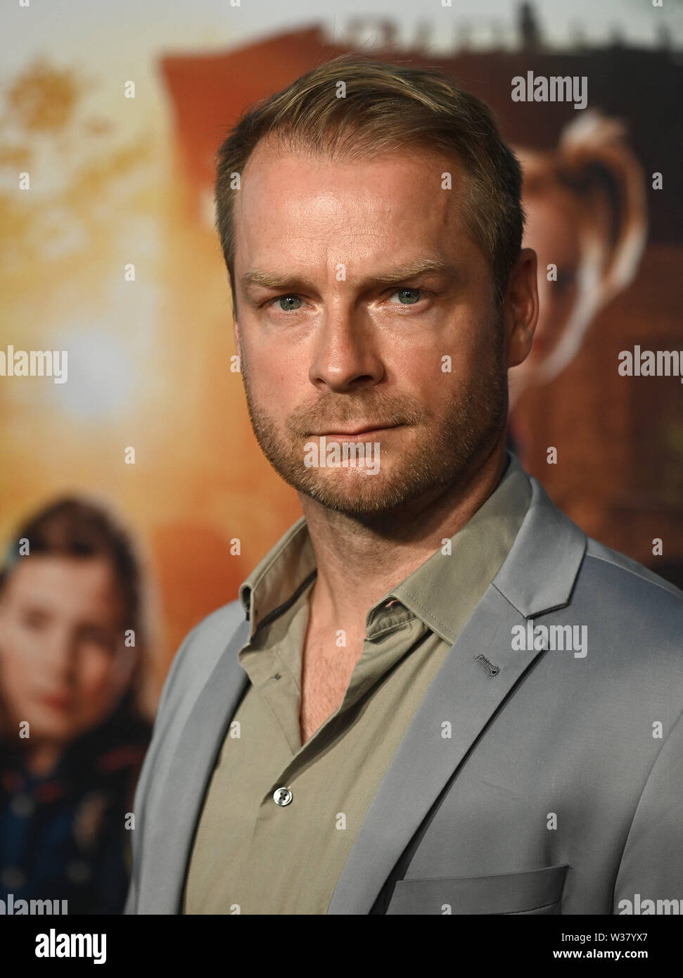 Köln, Deutschland. 13. Juli, 2019. Der Schauspieler Hinnerk Schönemann kommt zur Premiere der Film 'Die Drei!!!". Quelle: Henning Kaiser/dpa/Alamy leben Nachrichten Stockfoto