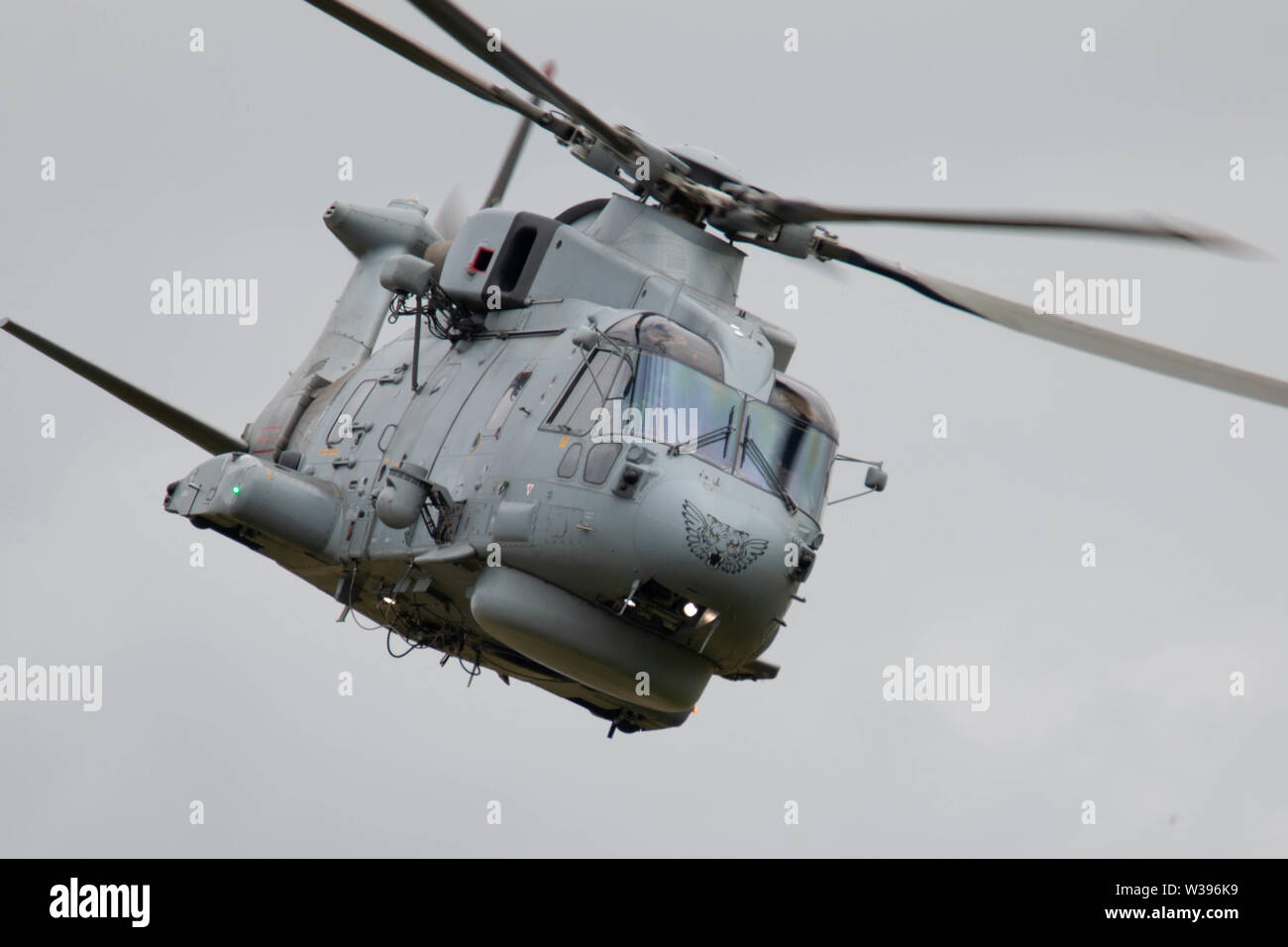 Yeovilton, UK. 13. Juli, 2019. Eine ASW Merlin von Rnas Culderose flog in der Anzeige, die Flugzeuge von gegenüber Acorss NATO-Verbündeten, darunter Litauen, Vereinigte Staaten und Kanada und die Teilnahme inklusive Beteiligten eine Reihe historische Flugzeuge und die RAFs rote Pfeile in diesem Jahre Yeovilton International Air Tag an der Royal Naval Air Station Yeovilton in Somerset Credit: Fotografieren Nord/Alamy leben Nachrichten Stockfoto