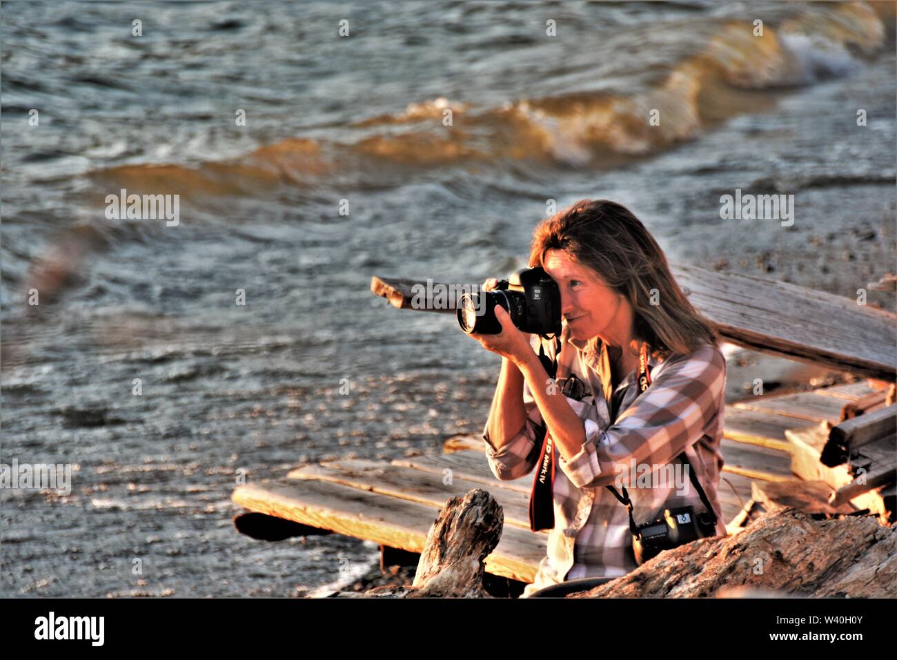 Fotograf Nyla James arbeitet sie an ihrem laufenden aufgegeben, Amerika, ihr eine Person Foto zeigen, in Clearlake California aktualisieren Bilder Stockfoto